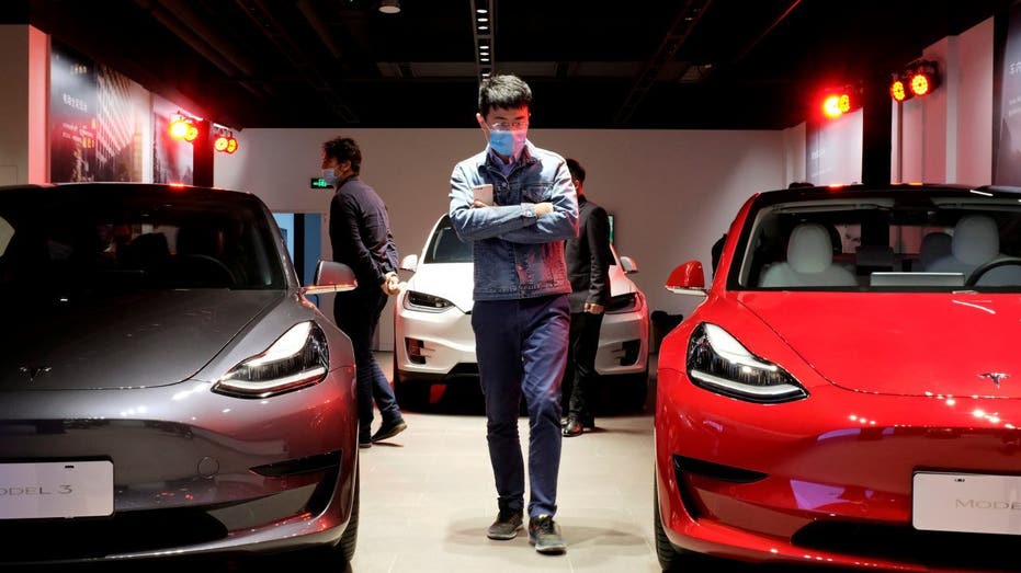A customer browses Tesla automobiles