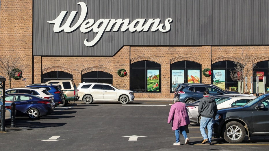 A couple in a Pennsylvania Wegmans supermarket parking lot