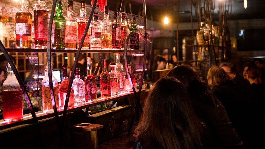 customers drink at a bar