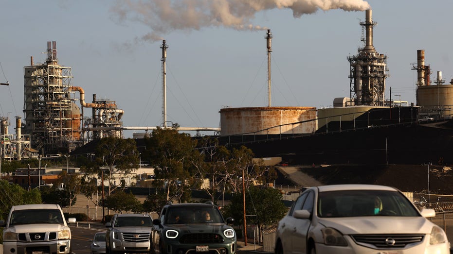Vehicles pass the Phillips 66 Los Angeles Refinery Wilmington Plant on November 28, 2022 in Wilmington, California.