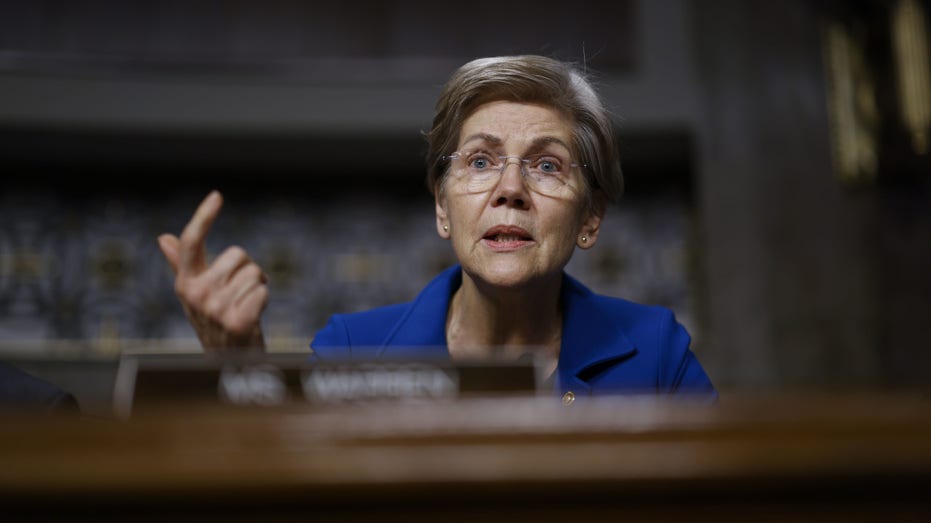 Massachusetts Senator Elizabeth Warren asks questions during a Senate Banking Committee hearing on FTX's collapse