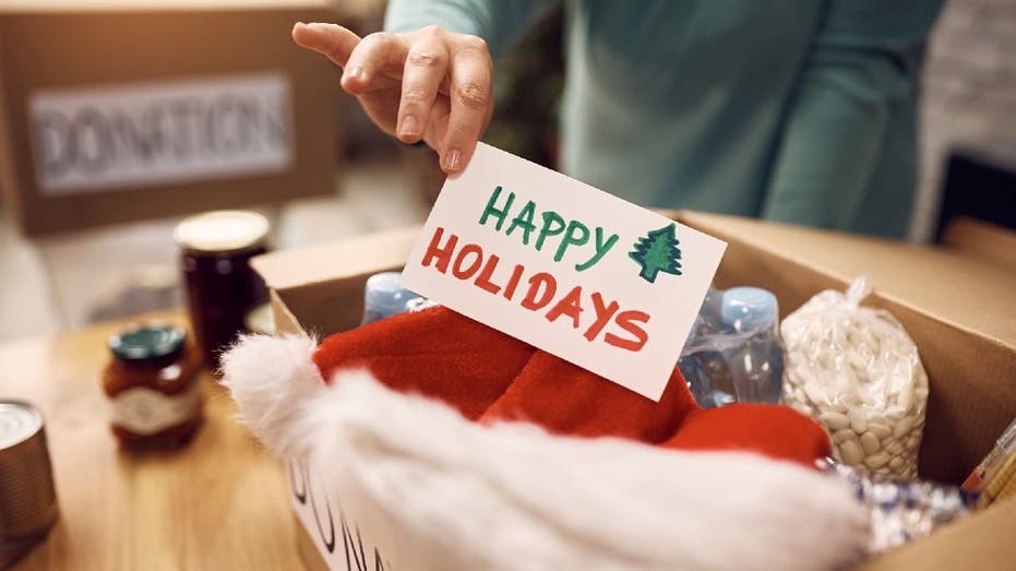 Holiday donations get placed in boxes