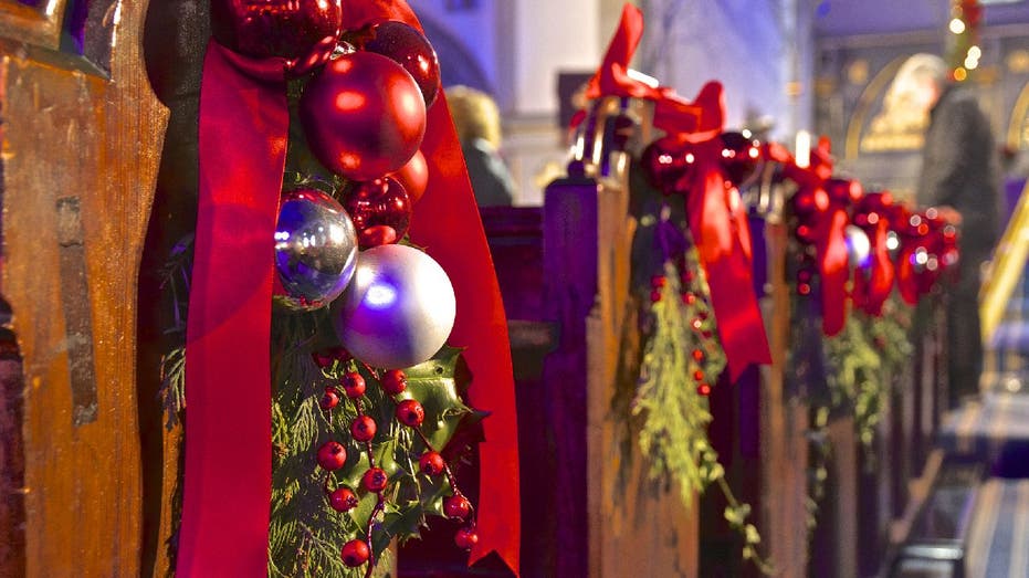 Church pews decorated for Christmas