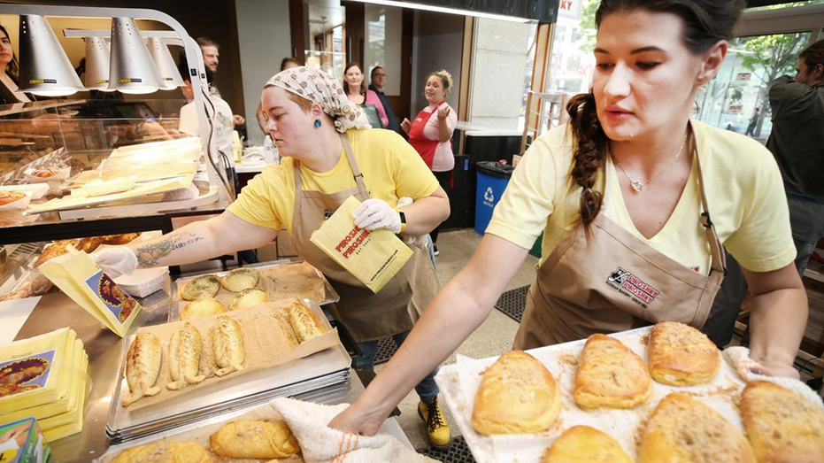 Olga Sagan, bakery owner, shown with pastries