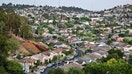 A view of houses in a neighborhood in Los Angeles, California, on July 5, 2022. - While two years of a booming US housing market brought wealth to many, a shortage of housing is making home ownership unaffordable for millions of Americans with prices up more than 30% over the past few years and interest rates rising. 