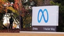 A security guard stands watch by the Meta sign outside the headquarters of Facebook parent company Meta Platforms Inc in Mountain View, California. 