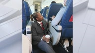 Viral photo shows Delta flight attendant comforting jittery passenger