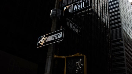A "Wall Street" sign in New York, US, on Friday, Jan. 27, 2023. Stocks ticked higher on Friday as fresh data that bolstered hopes for the Federal Reserve to downshift aggressive rate hikes overcame earlier concerns about weak company earnings. Photographer: John Taggart/Bloomberg via Getty Images