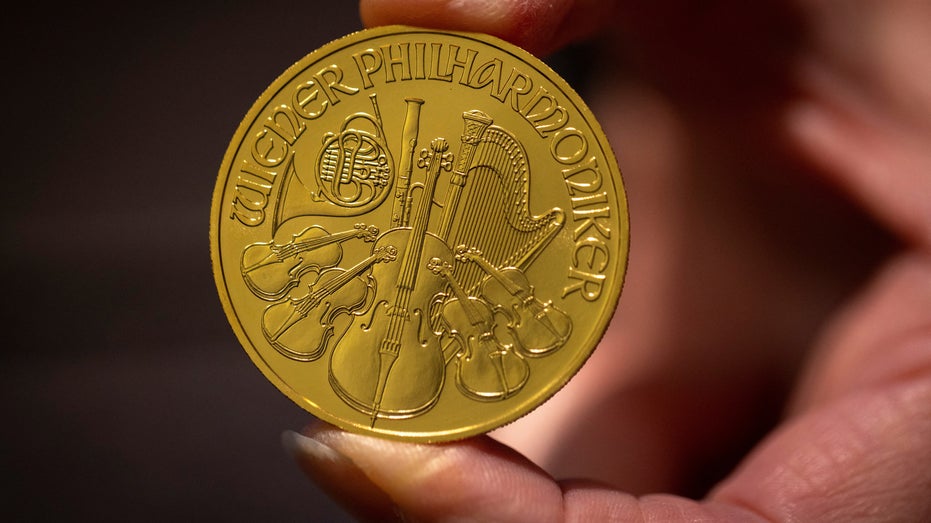 Vienna Philharmonic one-ounce gold coin in hand