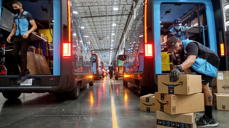 Amazon workers loading trucks