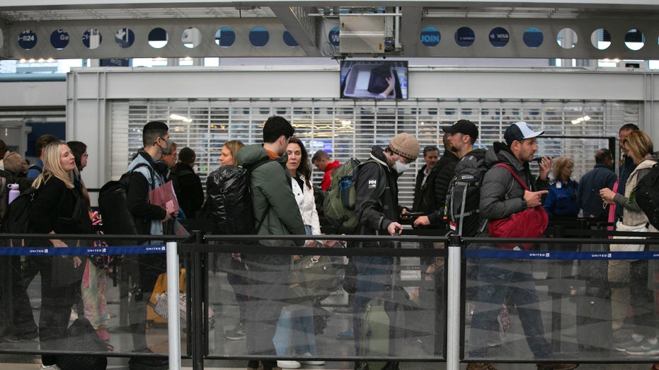 Passengers wait for the resumption of flights at O'Hare International Airport