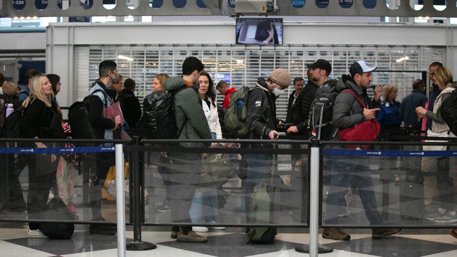 Passengers wait for the resumption of flights at O'Hare International Airport