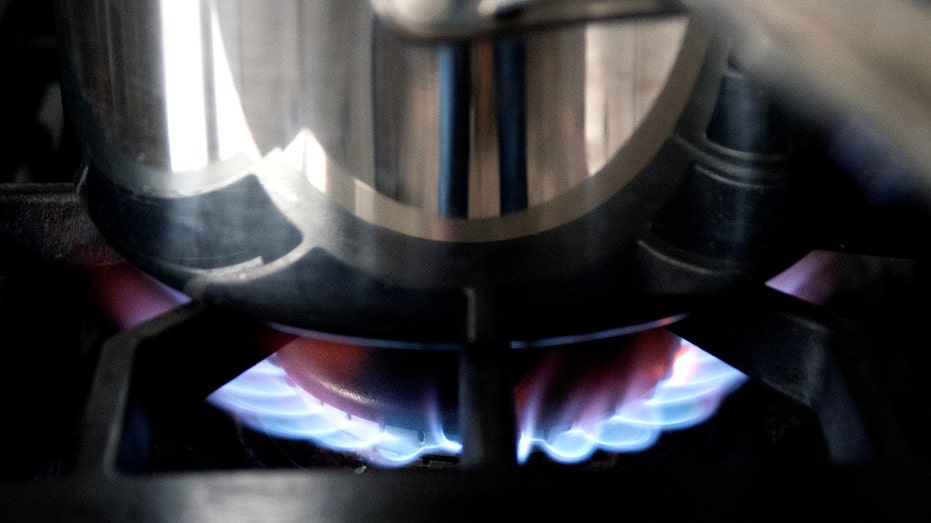 Pot sits on burning gas stove