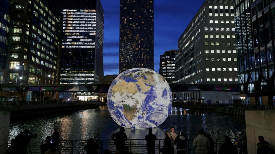 A globe sits in a fountain