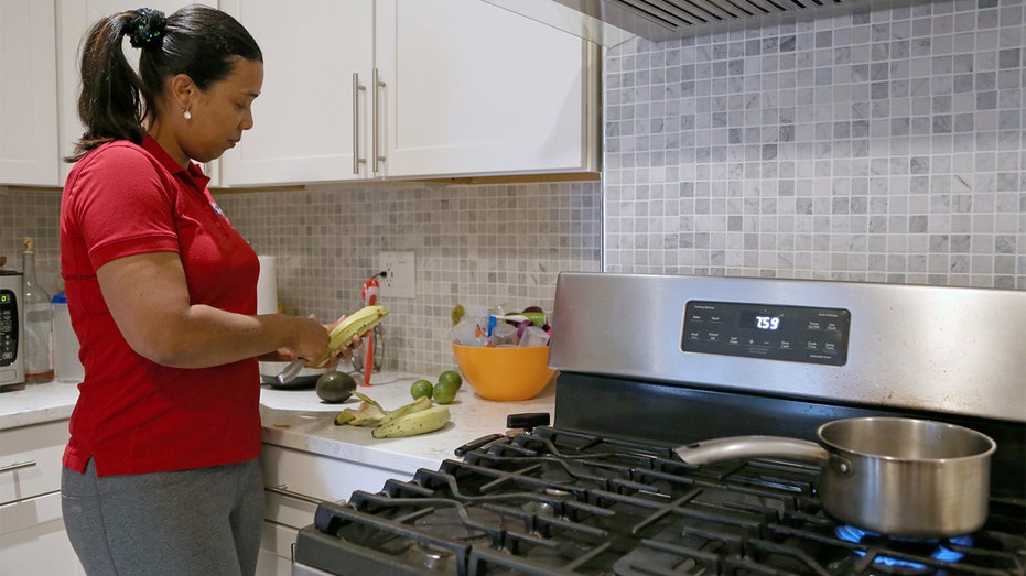 Massachusetts woman cooks on gas stove