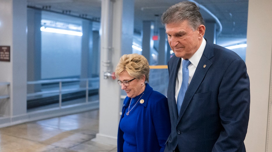 WASHINGTON, DC - FEBRUARY 4: Sen. Joe Manchin (D-WV) walks with his wife Gayle Conelly Manchin in the in the Senate subway at the U.S. Capitol on February 4, 2020 in Washington, DC. The Senate heard closing arguments yesterday after the Senate voted to block witnesses from appearing in the impeachment trial. The final vote is expected on Wednesday. (Photo by Alex Edelman/Getty Images)