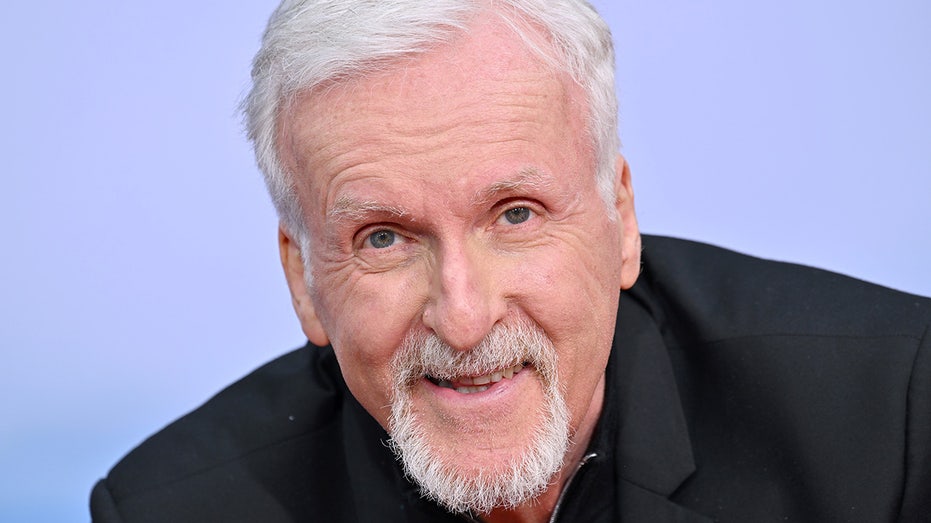 James Cameron up-close photo of him smiling in black outfit at the TCL Chinese Theatre