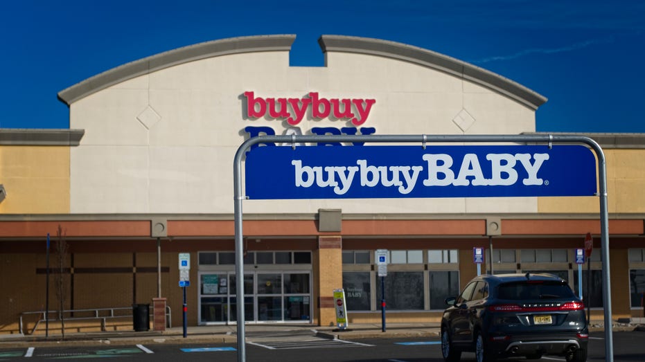 Buy Buy Baby store with cart return rack in foreground