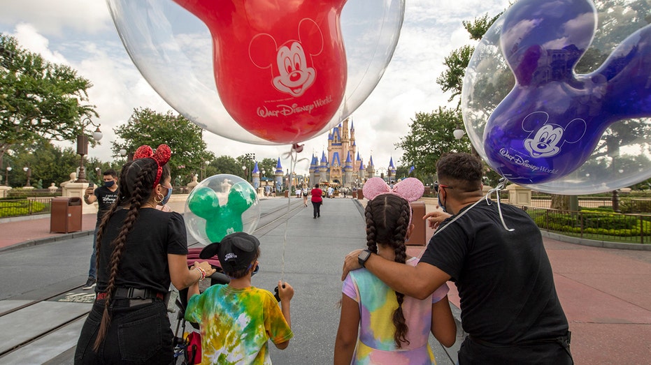 Family visits Magic Kingdom at Walt Disney World in Florida