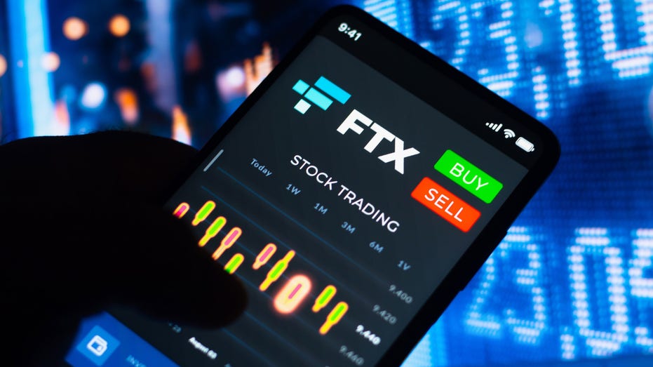 In this photo illustration, the stock trading graph of FTX Token (FTT) seen on a smartphone screen.