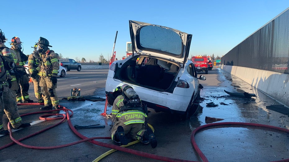 crews working under Tesla