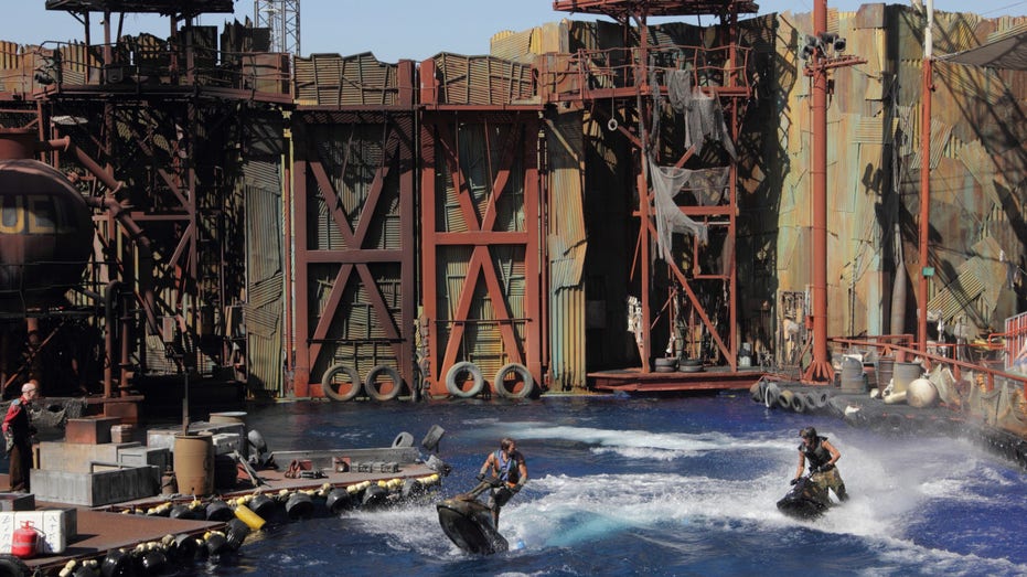 View of two stunt performers on Jet-Skis during Universal Studios Hollywood's 'Waterworld: A Live Sea War Spectacular' show
