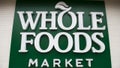 A Whole Foods Market sign is seen in Washington, DC, June 16, 2017, following the announcement that Amazon would purchase the supermarket chain for $13.7 billion. - Amazon is once again shaking up the retail sector, with the announcement it will acquire upscale US grocer Whole Foods Market, known for its pricey organic options,  in a deal that underscores the online giant's growing influence in the economy. 
