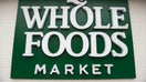A Whole Foods Market sign is seen in Washington, DC, June 16, 2017, following the announcement that Amazon would purchase the supermarket chain for $13.7 billion. - Amazon is once again shaking up the retail sector, with the announcement it will acquire upscale US grocer Whole Foods Market, known for its pricey organic options,  in a deal that underscores the online giant&apos;s growing influence in the economy. 