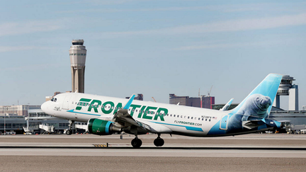 A Frontier Airlines plane lands at the McCarran International Airport in Las Vegas on Feb. 27, 2020.