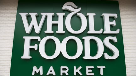 A Whole Foods Market sign is seen in Washington, DC, June 16, 2017, following the announcement that Amazon would purchase the supermarket chain for $13.7 billion. - Amazon is once again shaking up the retail sector, with the announcement it will acquire upscale US grocer Whole Foods Market, known for its pricey organic options,  in a deal that underscores the online giant's growing influence in the economy. 