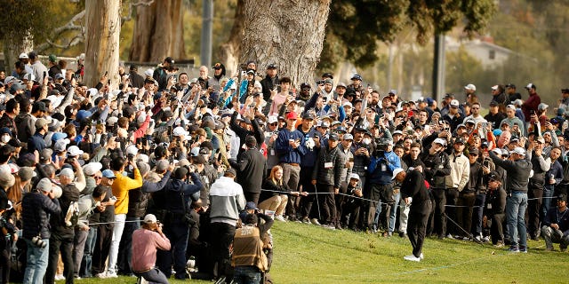 Tiger Woods plays a second shot on the 13th hole during the second round of The Genesis Invitational at Riviera Country Club in Los Angeles on Feb. 17, 2023.
