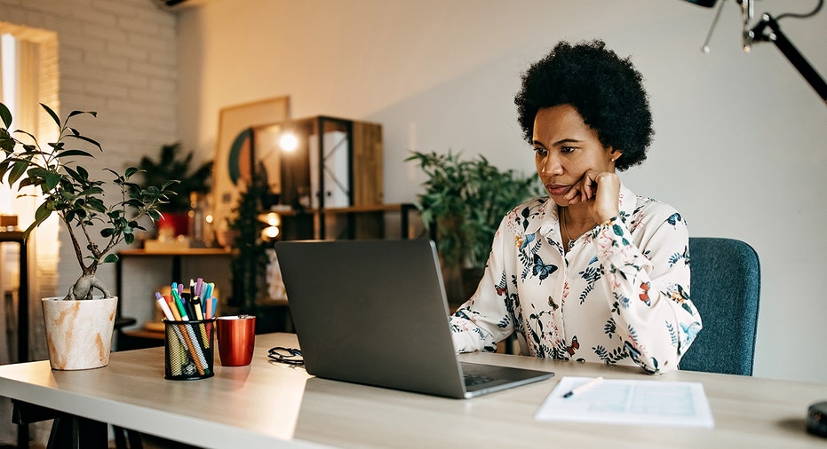 woman working on computer at home