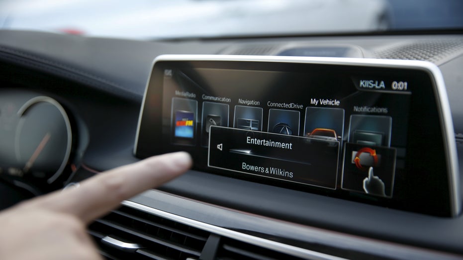 BMW's Vlatko Kalinic demonstrates a gesture control feature to control the radio volume in a 2016 BMW 750i sedan during the 2016 CES trade show in Las Vegas