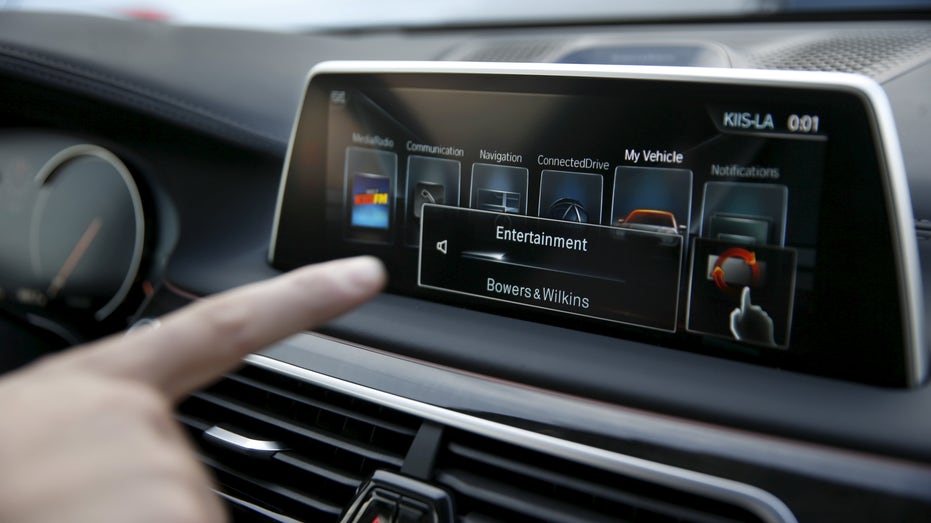 BMW's Vlatko Kalinic demonstrates a gesture control feature to control the radio volume in a 2016 BMW 750i sedan during the 2016 CES trade show in Las Vegas