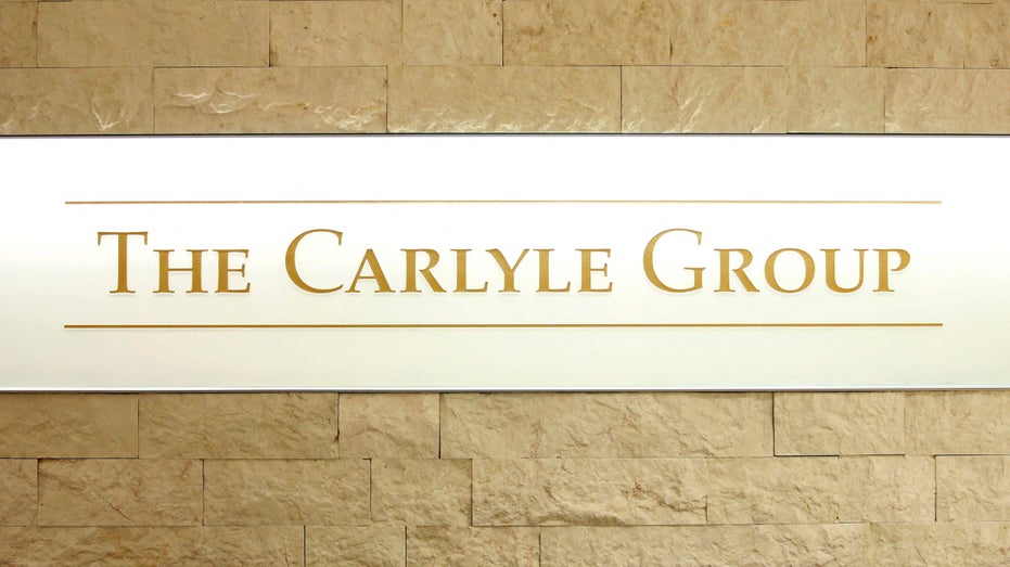 FILE PHOTO: The logo of The Carlyle Group is displayed at the company's office in Tokyo