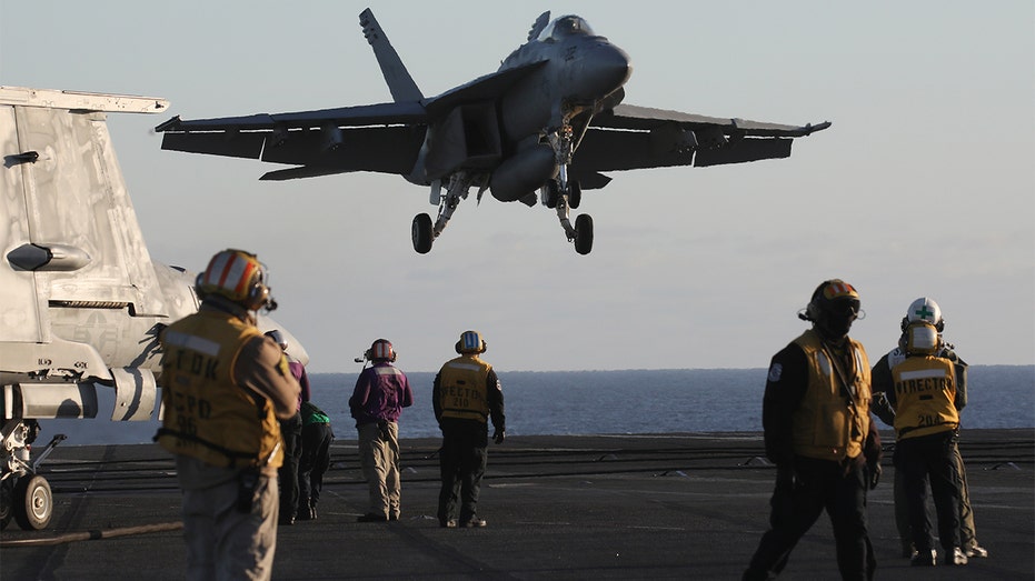 F/A-18E Super Hornet fighter jet lands on USS Nimitz carrier