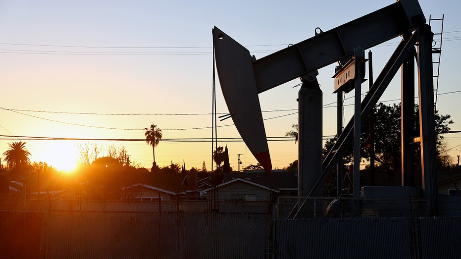 California oil pumpjack near house