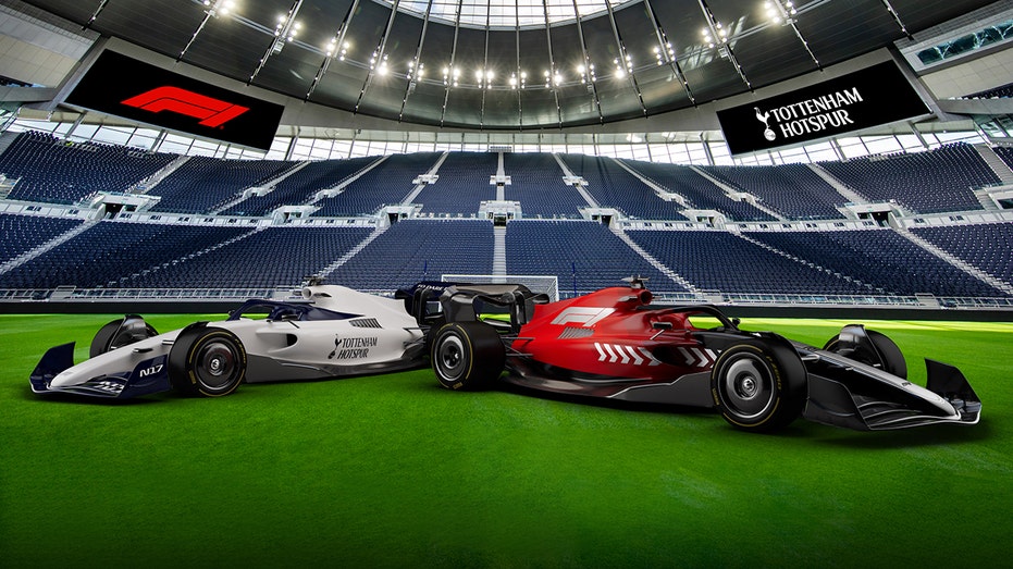 Formula 1 cars on soccer pitch