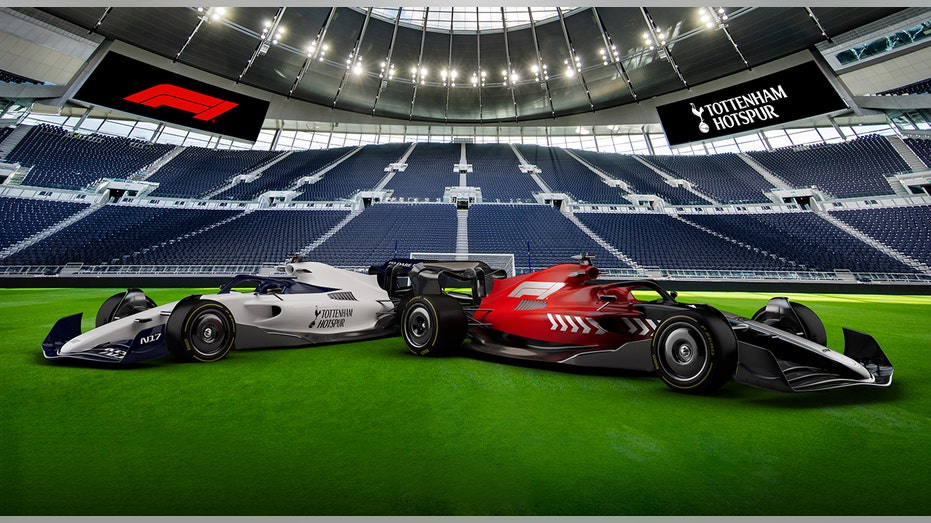 Formula 1 cars on soccer pitch