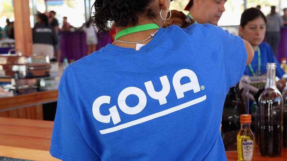 Worker serving Goya foods