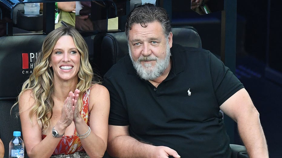 Russell Crowe with Britney Theriot at the Australian Open