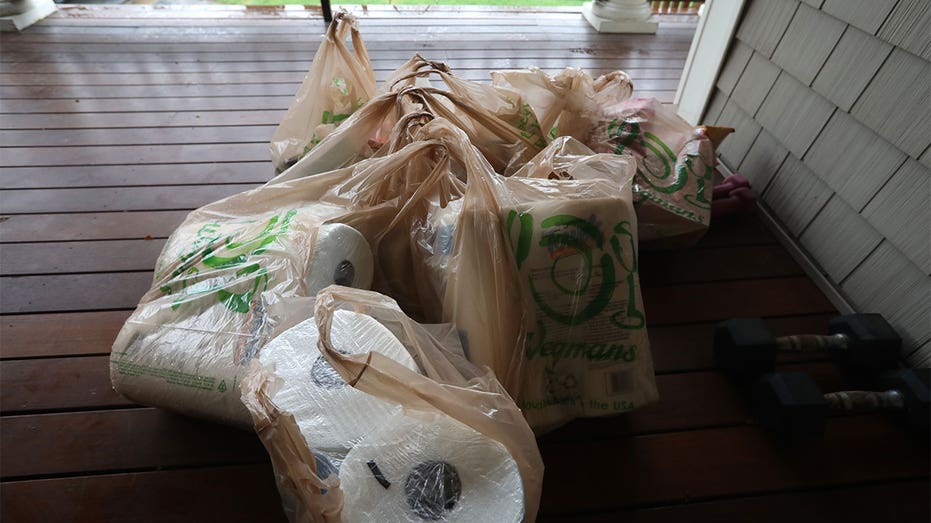 Grocery bags at the front door.