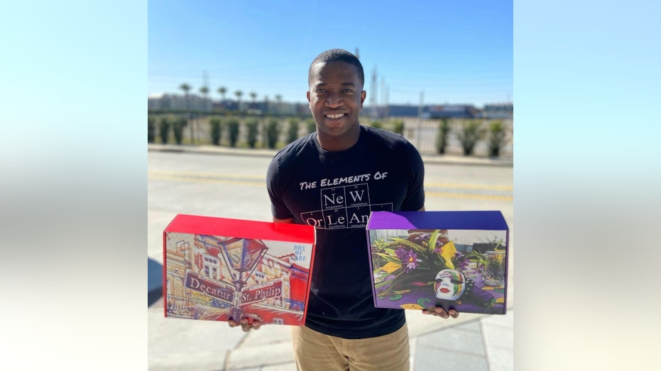 Man holding two decorative gift boxes