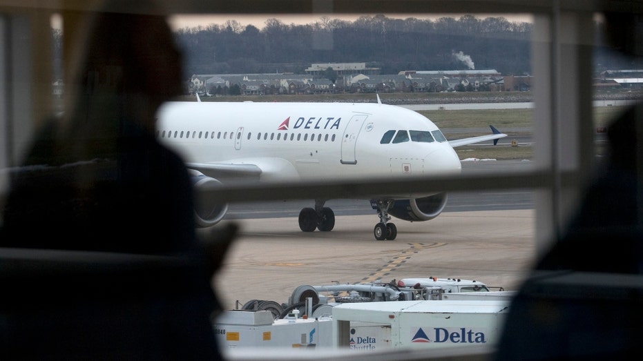 A Delta Air Lines Inc. jet taxis at Ronald Reagan International Airport