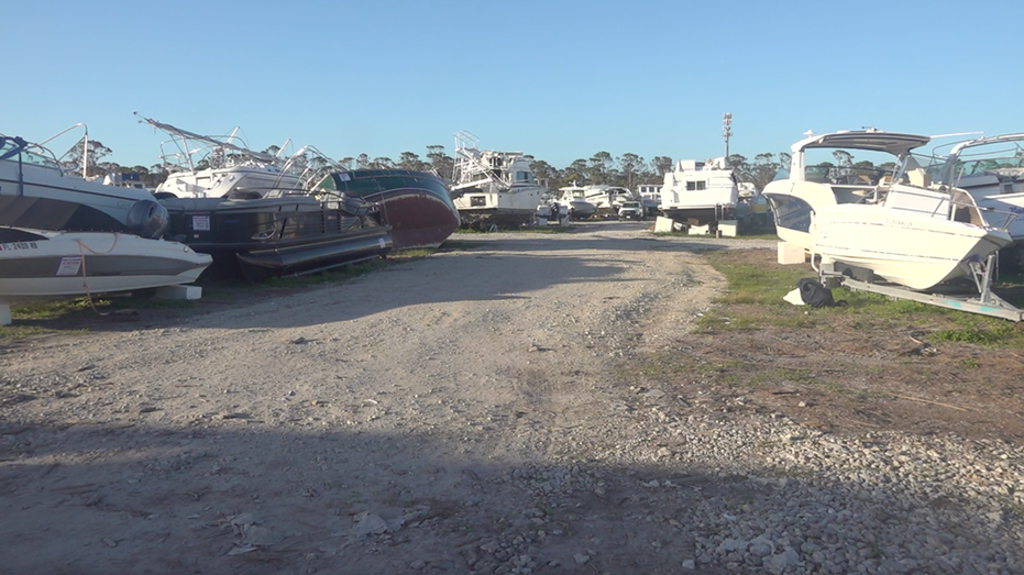 Nearly 200 damaged boats lie at an undisclosed location in Lee County, Florida.