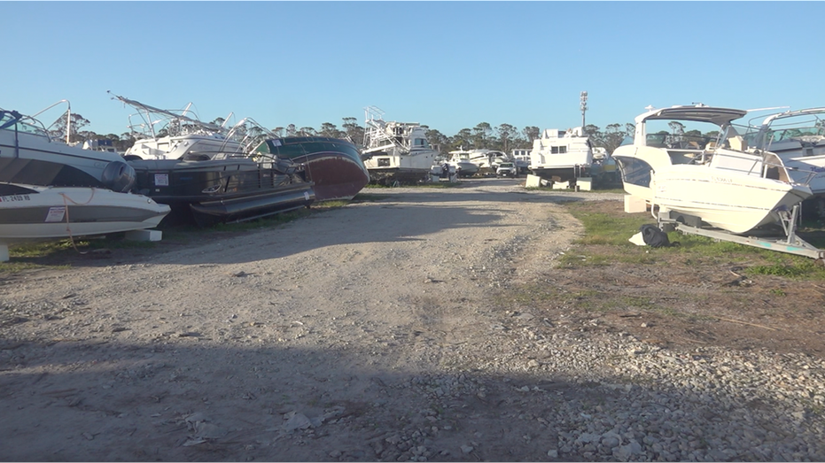 Nearly 200 damaged boats sit in an undisclosed location in Lee County, Fla.