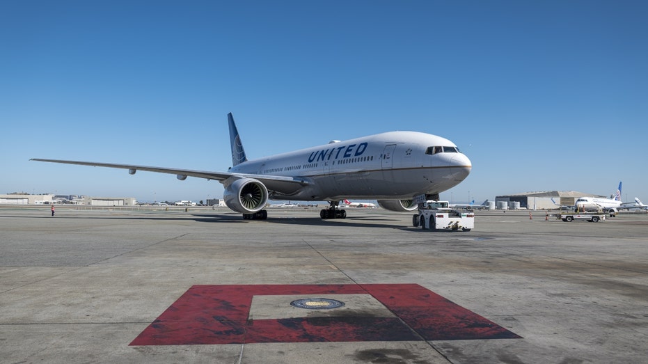 A United Airlines Boeing 777-200 aircraft on the tarmac