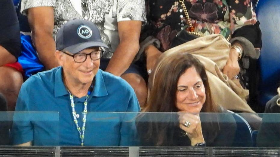 Bill Gates and Paula Hurd watching tennis