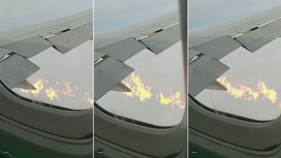 flames spouting from wing of plane