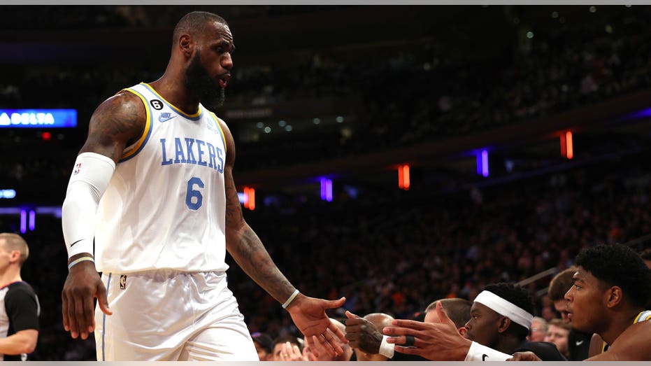 LeBron James high-fives teammates